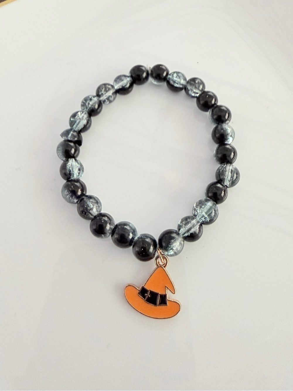 Black & Silver Beaded Bracelet with Orange Witch Hat Charm
